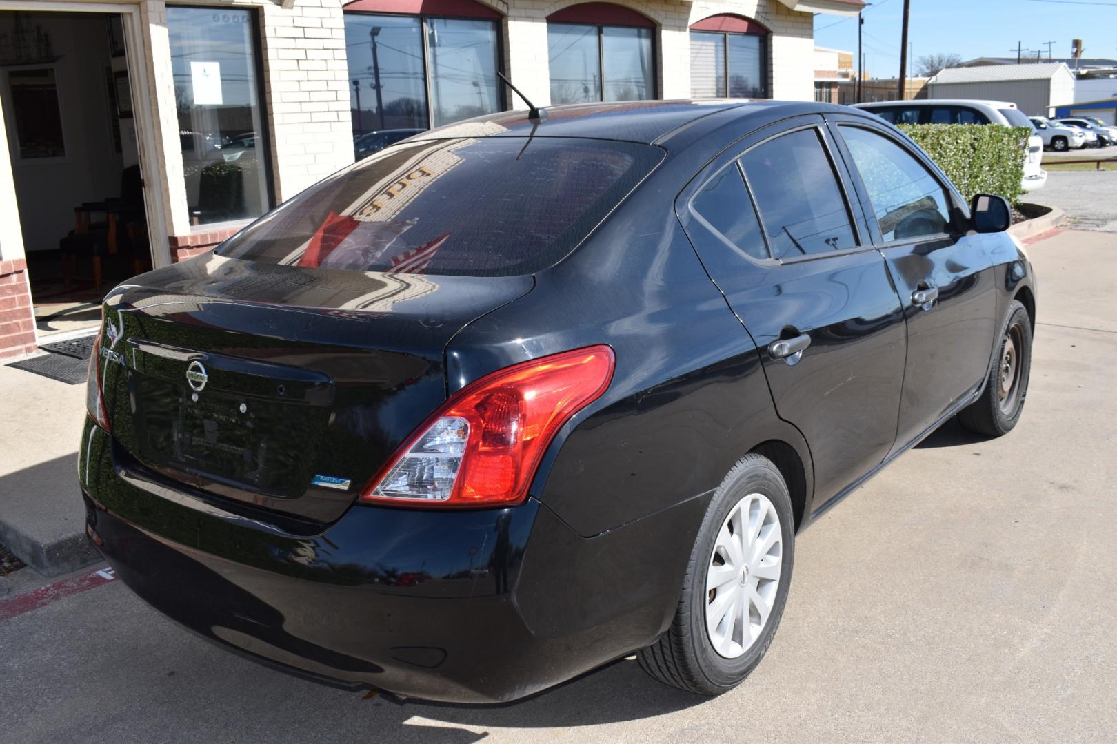 2014 Black /Black Nissan Versa 1.6 S 5M (3N1CN7AP2EL) with an 1.6L L4 DOHC 16V engine, CVT transmission, located at 5925 E. BELKNAP ST., HALTOM CITY, TX, 76117, (817) 834-4222, 32.803799, -97.259003 - The 2014 Nissan Versa 1.6 S 5M offers several benefits, including its fuel efficiency, spacious interior, and affordable price tag. It's also known for its reliability and low maintenance costs, making it a practical choice for budget-conscious buyers. Additionally, its simple yet functional design - Photo#4